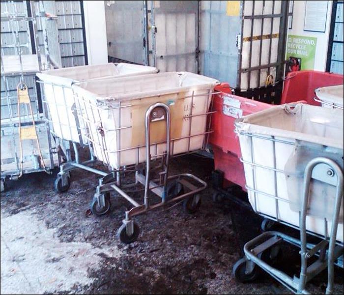 mail room with flood water on the floor